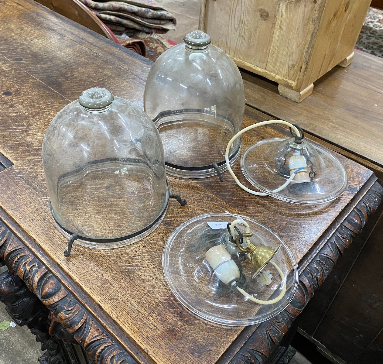 A pair of glass storm lanterns, height 32cm